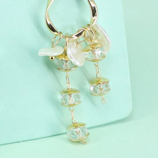 Dangling crystal golden earing with 925 silver tip