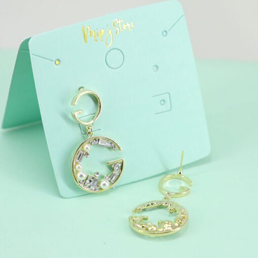 G elegant branded earrings