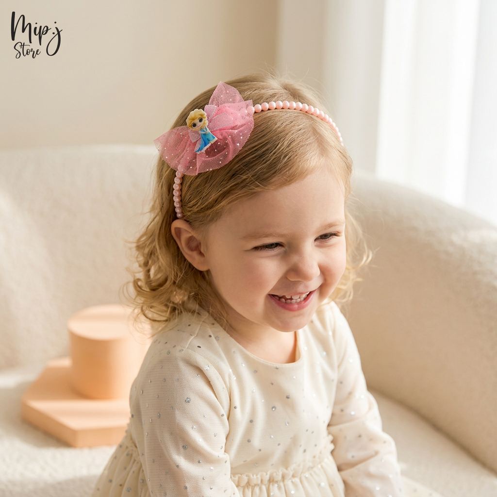 A set of three pink hairbands featuring a character resembling Elsa from Frozen, including a hairband, an alligator clip, and a pony accessory, displayed on a heart-shaped base.